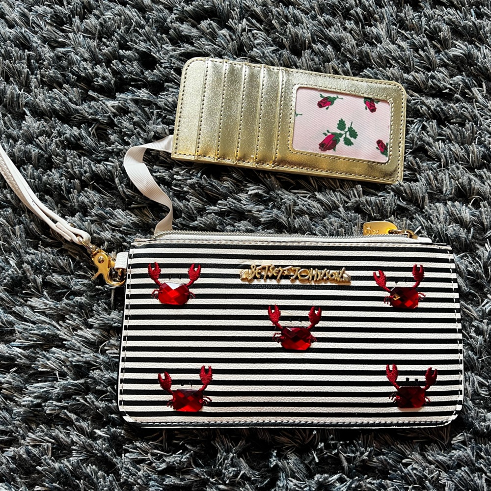 A crab design Betsey Johnson wristlet.